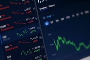 Financial trading screens showing market data, illustrating an article on CFTC regulation of prediction markets