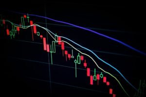 Trading screens showing market data, symbolizing prediction market regulation